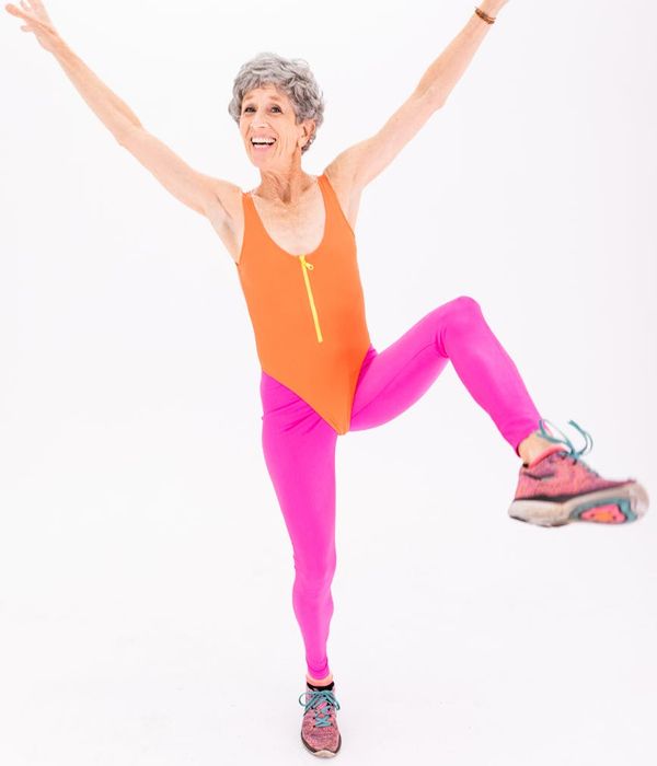 Smiling woman in activewear feeling energetic and full of life.